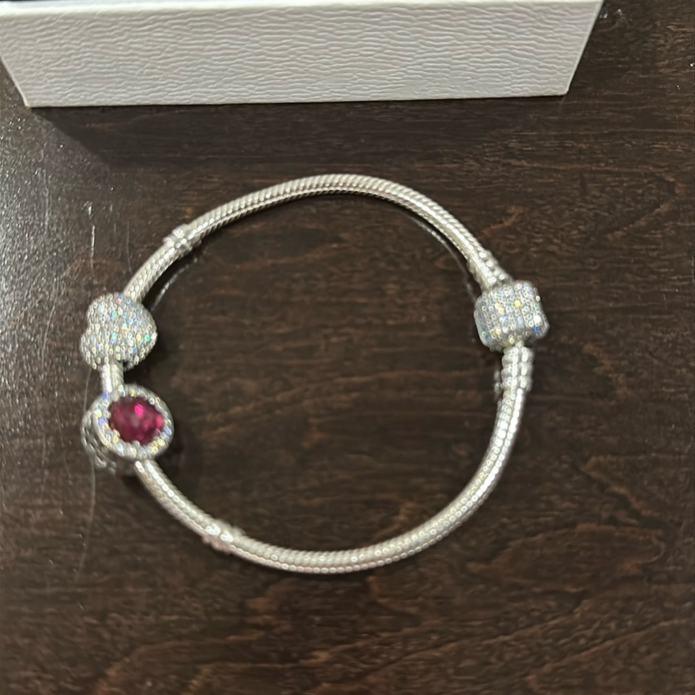 Pandora bracelet with three charms new in box